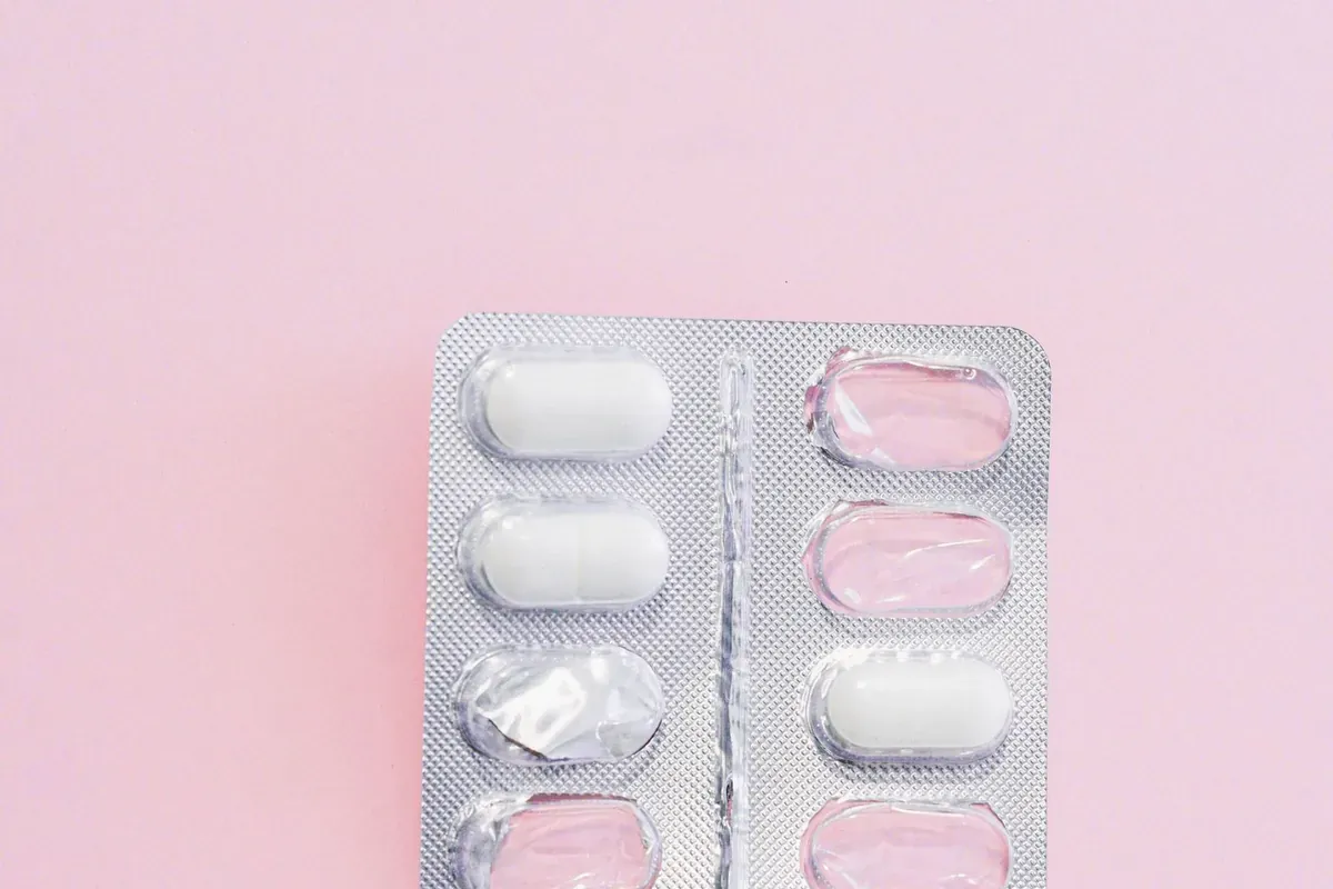 A blister pack of tablets on a plain background