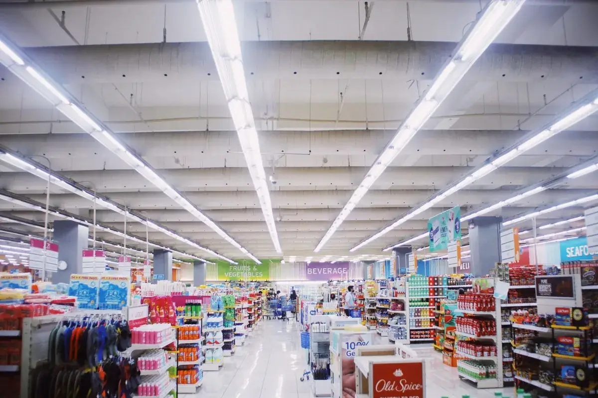 A brightly lit drugstore aisle lined with products